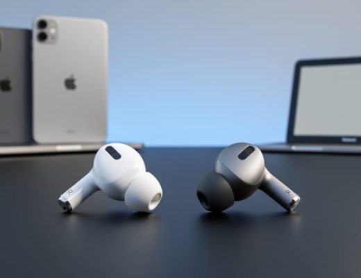 Two wireless earbuds—an AirPods-style earbud and a third-party in-ear design—resting on a matte-black surface with blurred smartphone and tablet shapes behind them.